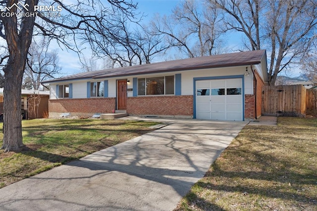 ranch-style house with a front yard and a garage