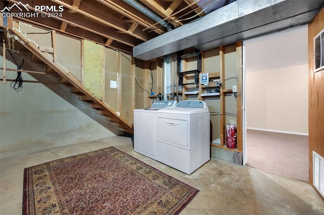 basement featuring separate washer and dryer