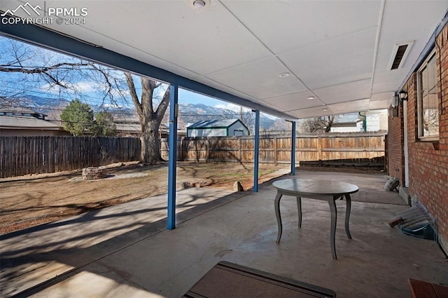 view of patio / terrace featuring a mountain view