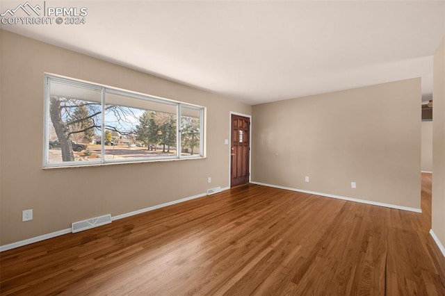 empty room featuring hardwood / wood-style floors