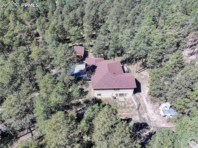 drone / aerial view with a forest view