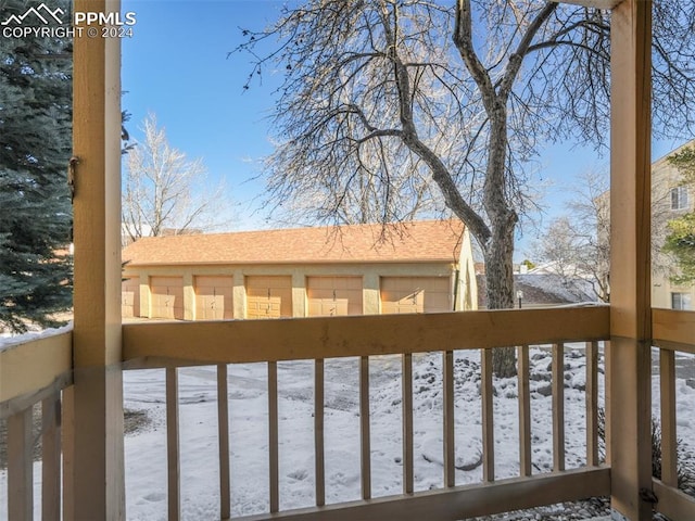 view of snow covered deck