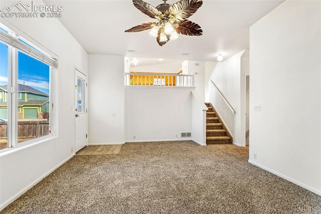 unfurnished room featuring carpet and ceiling fan