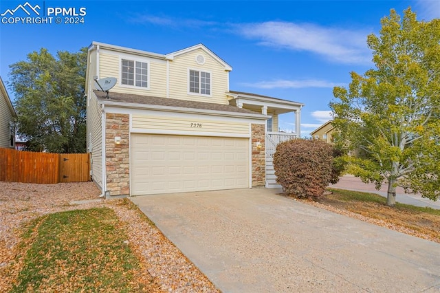 view of front of property with a garage