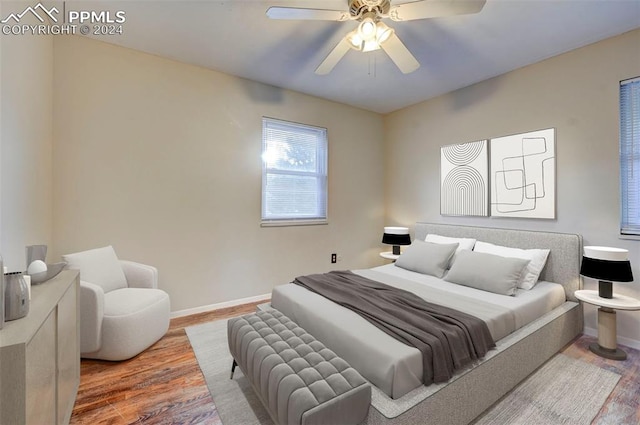 bedroom with hardwood / wood-style floors and ceiling fan