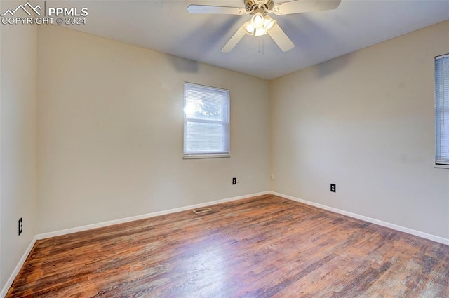 unfurnished room featuring hardwood / wood-style floors and ceiling fan