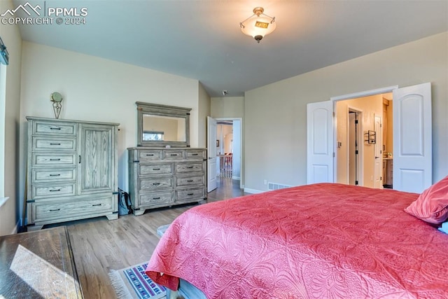 bedroom with light wood-type flooring