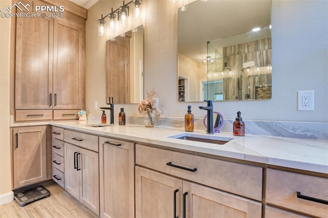 bathroom with vanity and hardwood / wood-style flooring