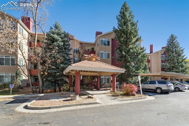 175 W Cheyenne Rd Unit 214, Colorado Springs, CO 80906 - view of building exterior with covered and uncovered parking