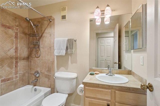 175 W Cheyenne Rd Unit 214, Colorado Springs, CO 80906 - bathroom featuring toilet, vanity, tub / shower combination, and baseboards