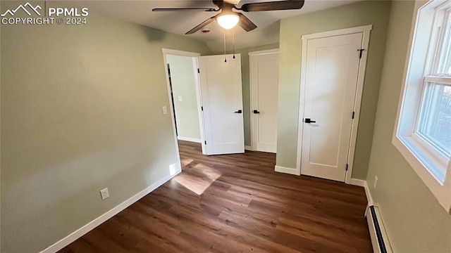 unfurnished bedroom featuring dark hardwood / wood-style flooring and ceiling fan