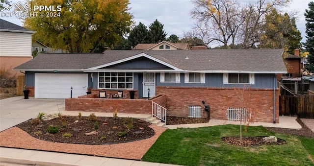 view of front facade featuring central AC unit and a garage