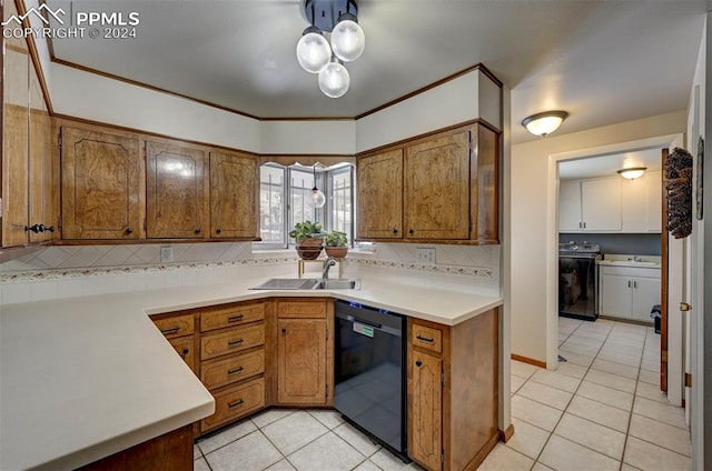 kitchen with light tile patterned flooring, sink, independent washer and dryer, decorative backsplash, and black dishwasher