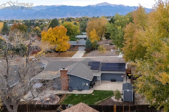 birds eye view of property featuring a mountain view