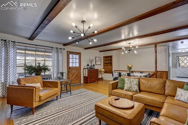 living room with light hardwood / wood-style floors, a notable chandelier, and beam ceiling