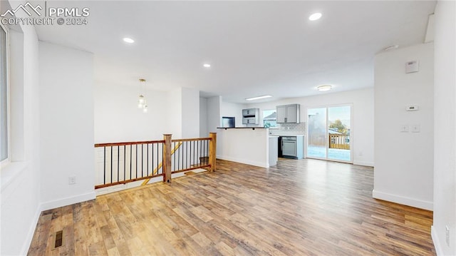 unfurnished living room featuring light hardwood / wood-style floors