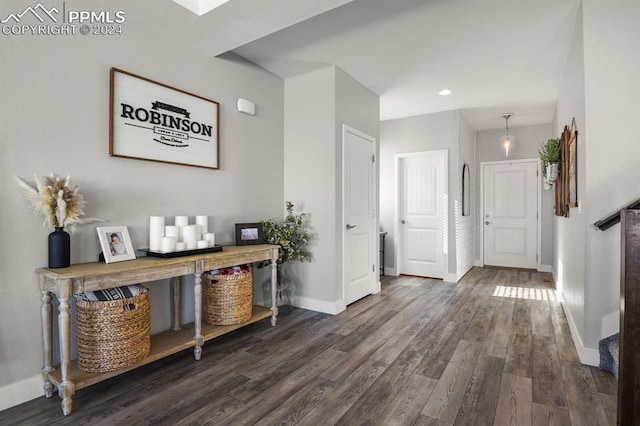 hall with dark hardwood / wood-style floors