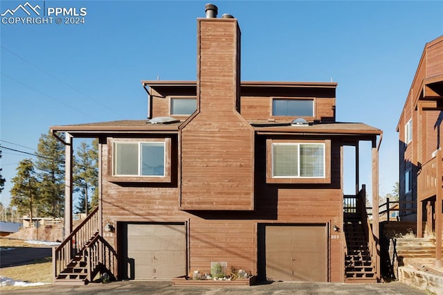 view of front of property with a garage