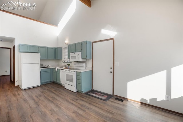 kitchen with white appliances, high vaulted ceiling, dark wood-type flooring, and sink
