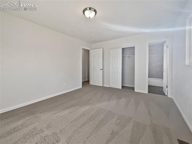 unfurnished bedroom featuring dark carpet