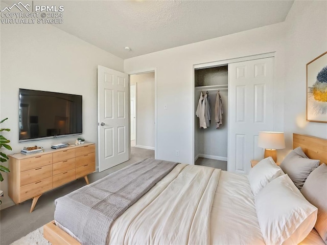 bedroom featuring a closet, a textured ceiling, and light colored carpet