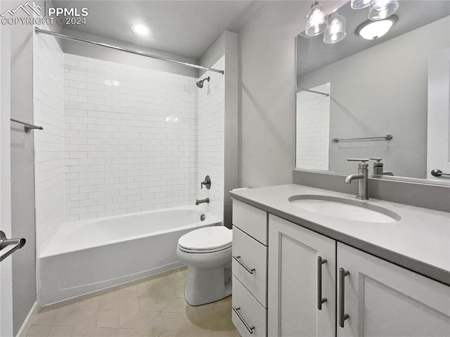 full bathroom featuring vanity, toilet, and tiled shower / bath