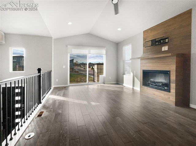 unfurnished living room with wood-type flooring and vaulted ceiling