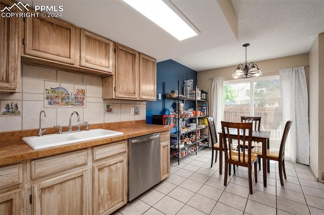 kitchen with dishwasher, hanging light fixtures, sink, and wood counters