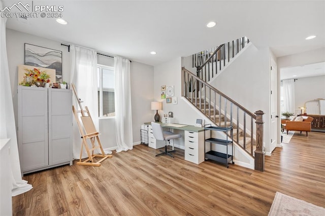 office area with light hardwood / wood-style floors