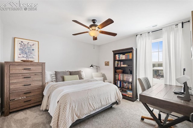 bedroom featuring light carpet and ceiling fan