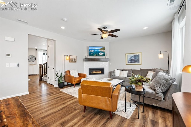 living room featuring hardwood / wood-style flooring and ceiling fan