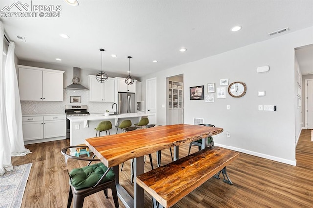 dining room featuring wood-type flooring