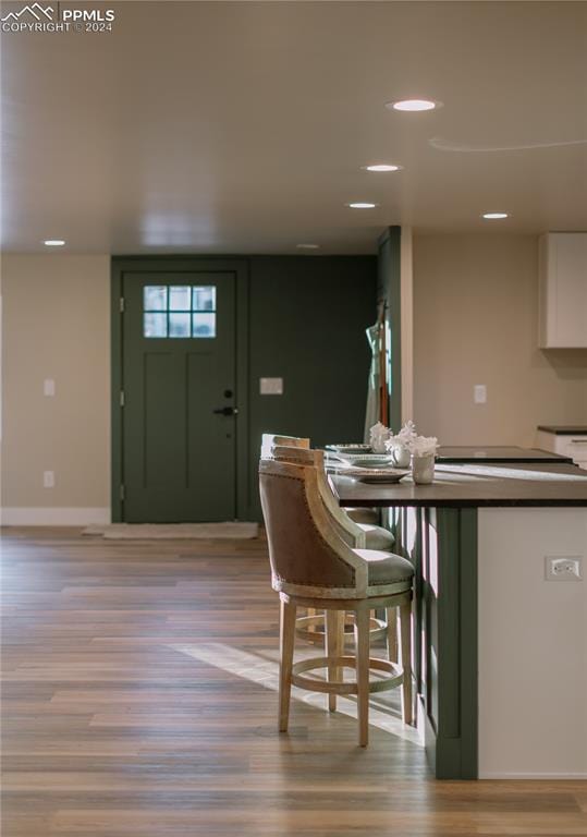 kitchen featuring white cabinetry and light wood-type flooring