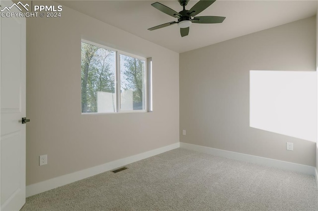 carpeted empty room with ceiling fan