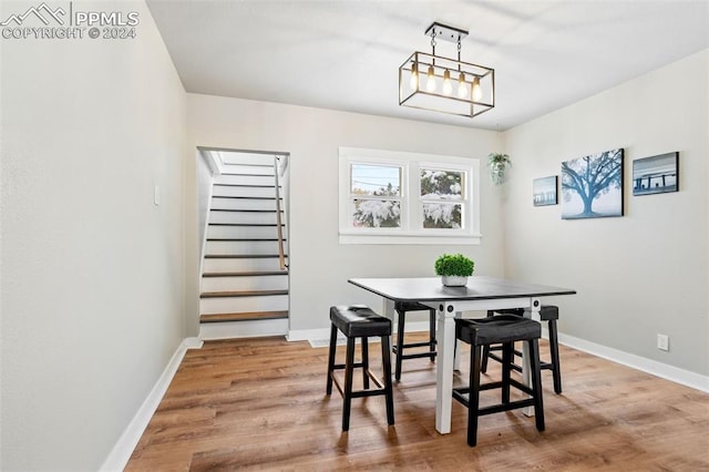 dining area with hardwood / wood-style flooring