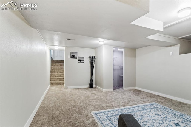 basement with carpet flooring