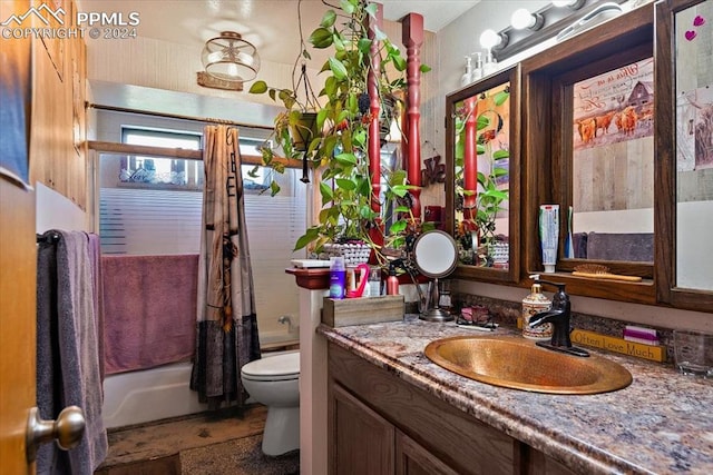 full bathroom with toilet, vanity, and shower / tub combo with curtain