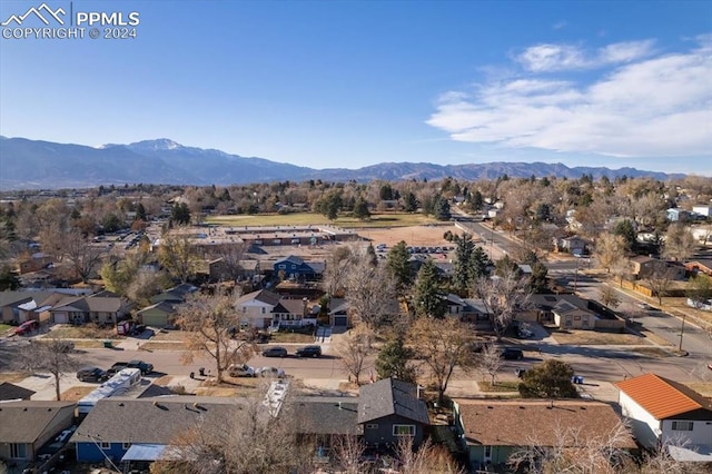 birds eye view of property with a mountain view