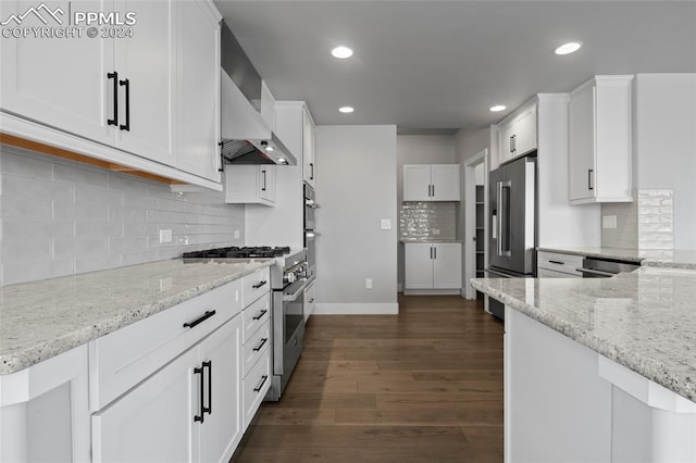 kitchen featuring decorative backsplash, dark hardwood / wood-style flooring, light stone counters, high end appliances, and white cabinetry