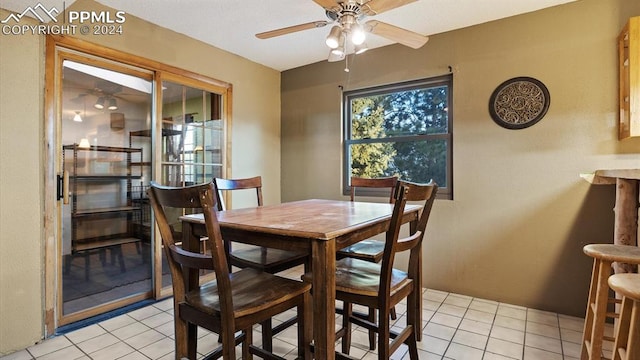 dining room featuring ceiling fan and light tile patterned floors