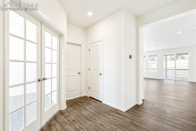 hallway featuring french doors and dark hardwood / wood-style flooring