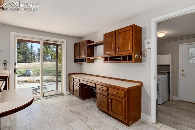 kitchen with washer / clothes dryer and built in desk