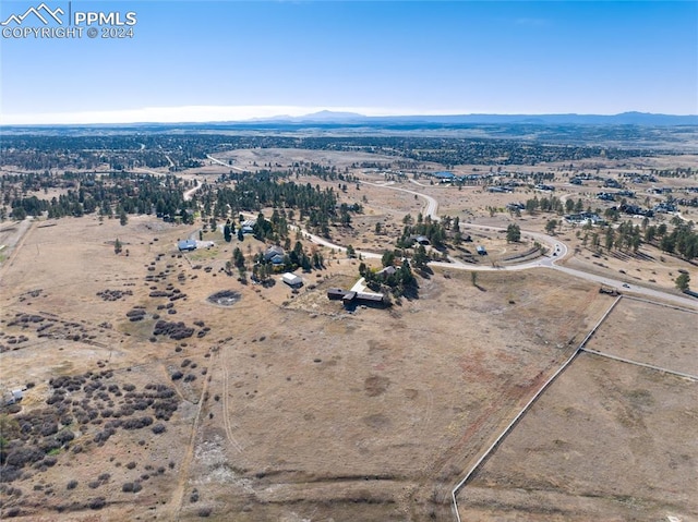 birds eye view of property featuring a mountain view