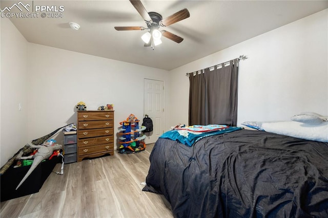 bedroom featuring light wood-type flooring and ceiling fan