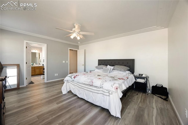 bedroom with ceiling fan, wood-type flooring, ornamental molding, and ensuite bath