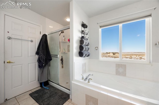 bathroom featuring shower with separate bathtub and tile patterned floors