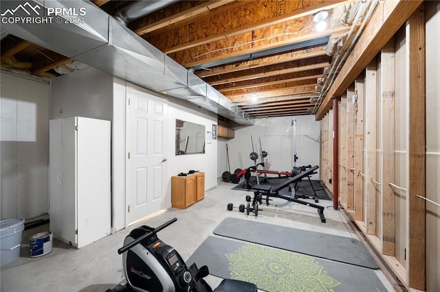 workout room featuring concrete flooring