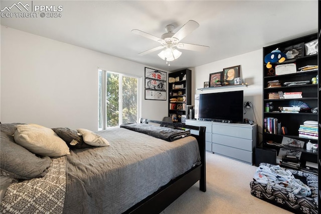 bedroom featuring light colored carpet and ceiling fan