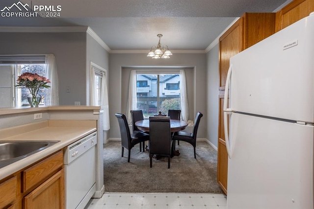 dining room with a wealth of natural light, a chandelier, and ornamental molding