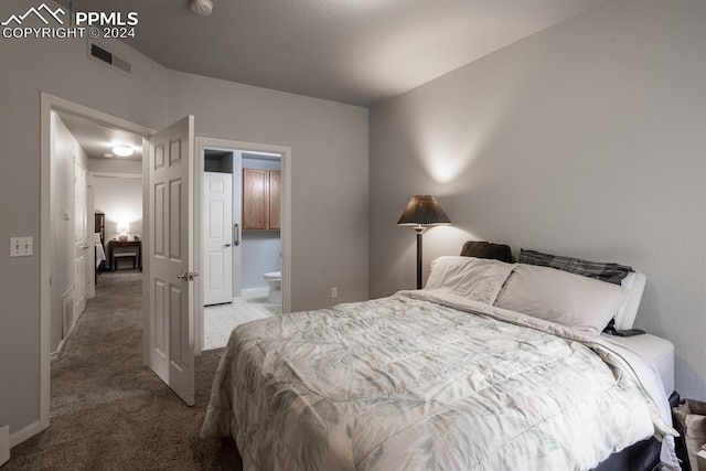 carpeted bedroom with connected bathroom